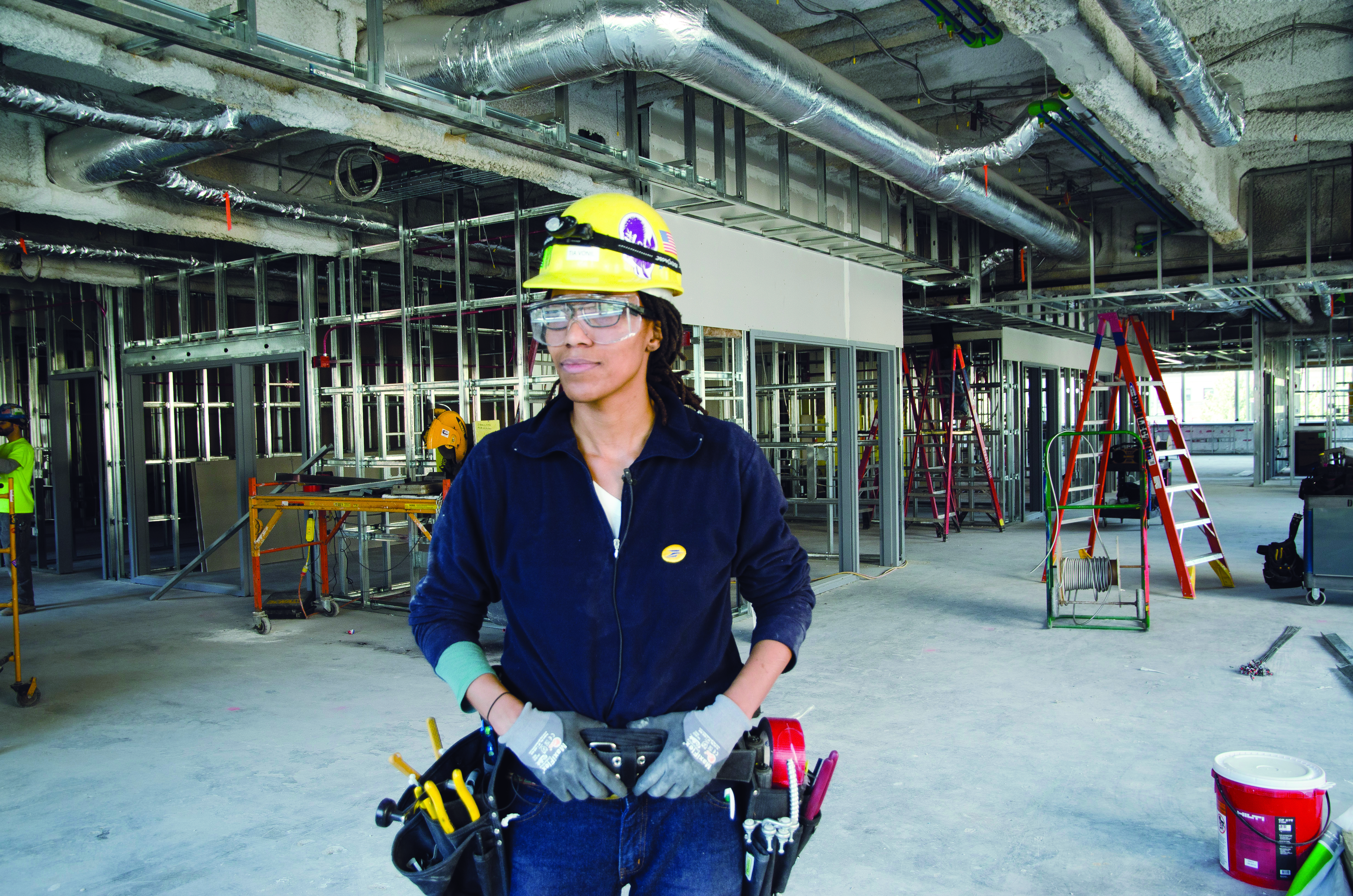 Worker in hardhat on construction site