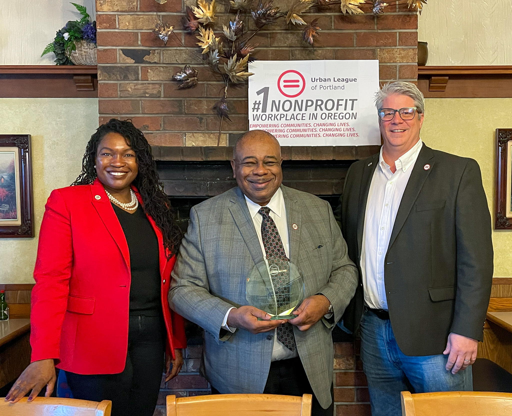 President Nkenge Harmon Johnson, outgoing Chairman Michael E. Lewellen, and newly elected Chairman Eric Olson